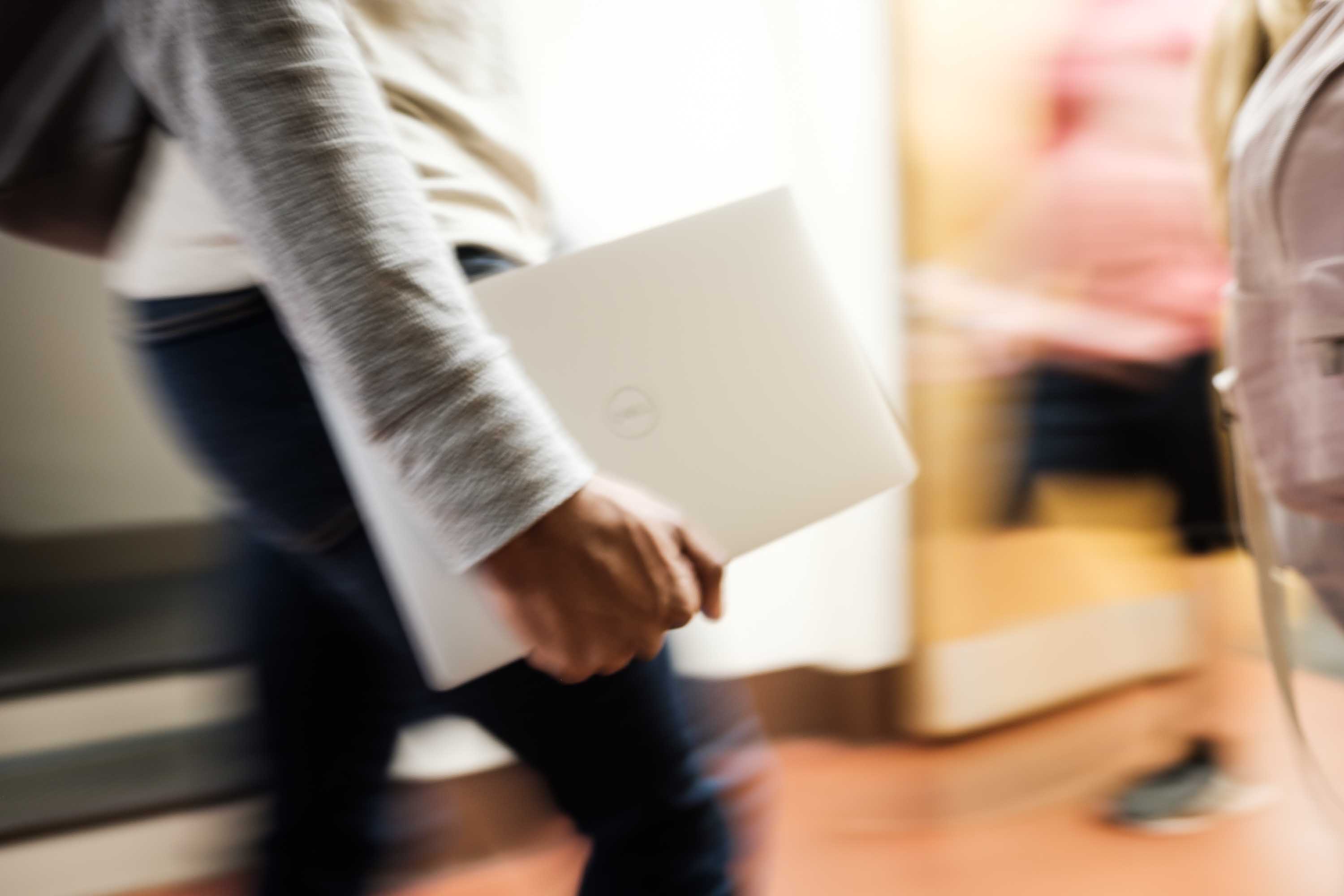 Student carrying a WakeWare laptop