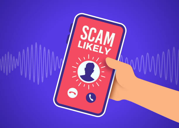 hand holding a cell phone that reads scam likely