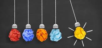 Crumpled up paper on the end of a string - looks like a lightbulb signifying an idea