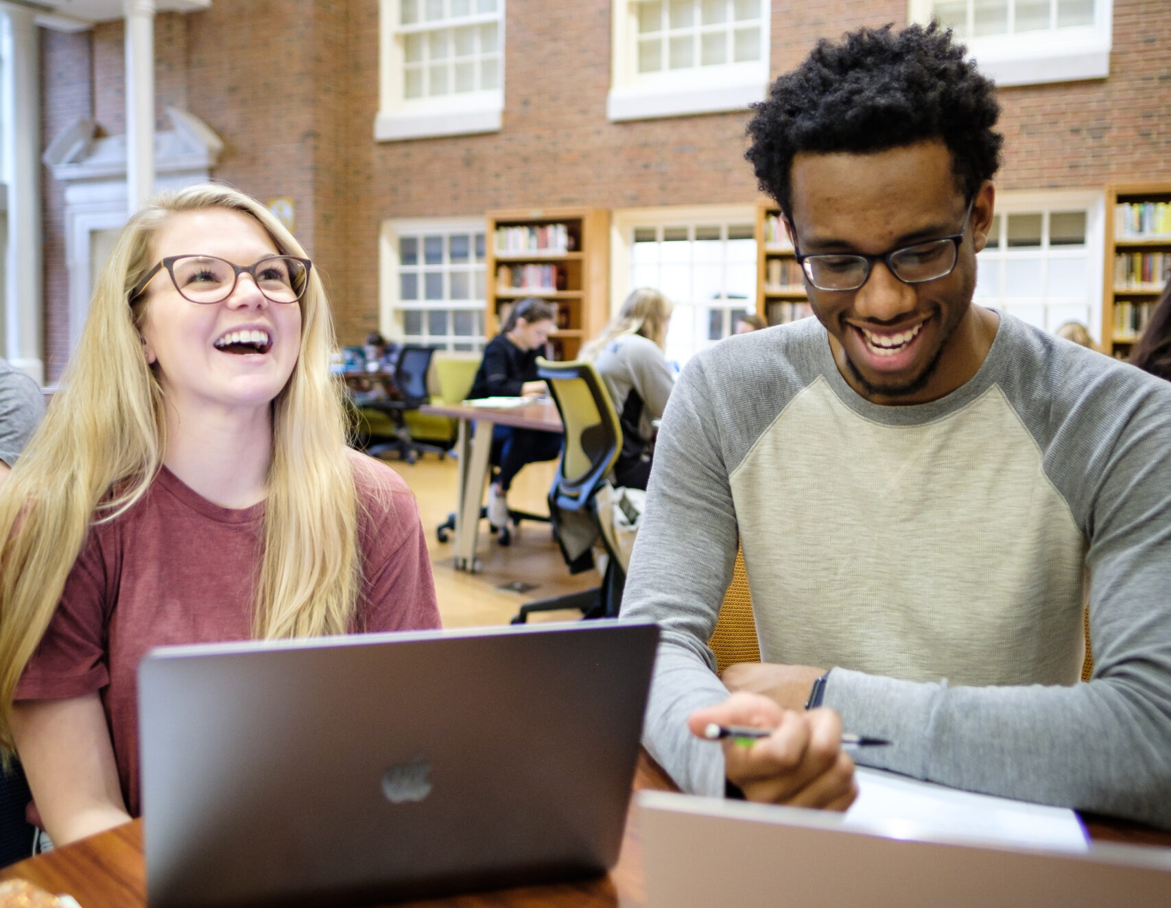 picture of two students in the ZSR Library on their computers