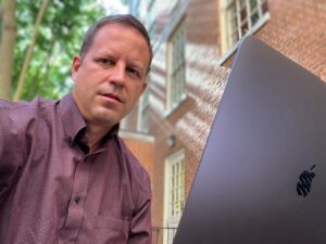 Brian Calhoun behind laptop